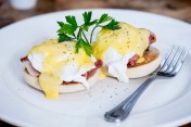 Eggs Benedict with poached egg, bacon, muffin and Hollandaise sauce